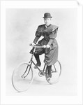 Suffragette Dressed in Man's Hat on Bicycle by Anonymous