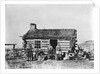 Mormon Family Outside Log Cabin by Anonymous