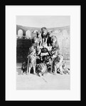 Animal Trainer Posing with Lions by Anonymous