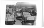 Chinese Men Pulling Heavy Loads of Silver Bullion by Corbis