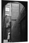 Man Outside Ye Olde Mitre Tavern by Corbis