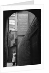 Man Outside Ye Olde Mitre Tavern by Corbis