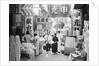 People Shopping in Market by Anonymous