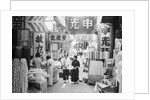 People Shopping in Market by Anonymous
