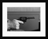 Hand Holding Colt .38 Special Revolver by Anonymous