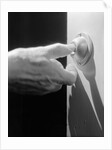 Hand Pressing a Door Bell by Anonymous