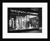 Lighted Window Display of a Dress Shop by Anonymous