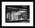 Lighted Window Display of a Dress Shop by Anonymous