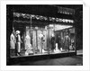 Lighted Window Display of a Dress Shop by Anonymous