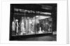 Lighted Window Display of a Dress Shop by Anonymous