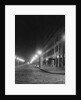 Street Lights Along a Cobblestone Street by Anonymous