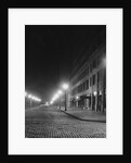 Street Lights Along a Cobblestone Street by Anonymous