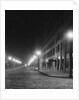 Street Lights Along a Cobblestone Street by Anonymous