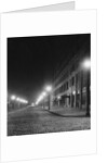 Street Lights Along a Cobblestone Street by Anonymous