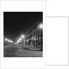 Street Lights Along a Cobblestone Street by Anonymous