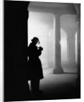 Silhouette of Man Lighting Pipe by Anonymous