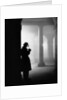 Silhouette of Man Lighting Pipe by Anonymous