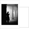 Silhouette of Man Lighting Pipe by Anonymous