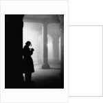 Silhouette of Man Lighting Pipe by Anonymous