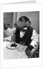 Chimpanzee Dining at a Table by Anonymous