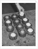 Golf Balls in Molds by Anonymous