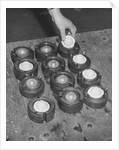 Golf Balls in Molds by Anonymous