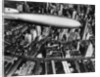 The German airship, the Hindenburg, above Manhattan, New York in 1936, on its way to its berth at Lakehurst , New Jersey, the same place where it inexplicably burst into flames the next year. by Anonymous