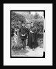 Elderly Couple Standing by Fence by Anonymous