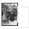 Elderly Couple Standing by Fence by Anonymous