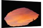 Hiker Climbing a Natural Arch in Utah by Anonymous