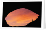 Hiker Climbing a Natural Arch in Utah by Anonymous