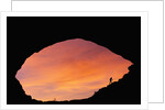Hiker Climbing a Natural Arch in Utah by Anonymous
