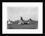 A Native American Family Sits Outside Their Teepee by Corbis