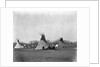 A Native American Family Sits Outside Their Teepee by Corbis