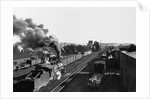Engine Moving Through a Rail Yard by Anonymous