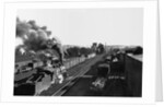 Engine Moving Through a Rail Yard by Anonymous