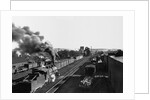 Engine Moving Through a Rail Yard by Anonymous