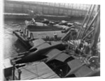 Heavy bombers on barges awaiting loading onto cargo vessel in New York harbor for shipment under provisions of the lend-lease by Anonymous