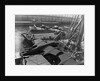 Heavy bombers on barges awaiting loading onto cargo vessel in New York harbor for shipment under provisions of the lend-lease by Anonymous