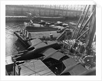 Heavy bombers on barges awaiting loading onto cargo vessel in New York harbor for shipment under provisions of the lend-lease by Anonymous
