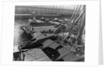 Heavy bombers on barges awaiting loading onto cargo vessel in New York harbor for shipment under provisions of the lend-lease by Anonymous