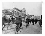 Los Angeles Police Officers Bicycling Past Broadway Storefronts by Anonymous