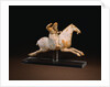 A Rare Painted Pottery Figure of a Female Polo Player by Anonymous