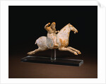 A Rare Painted Pottery Figure of a Female Polo Player by Anonymous