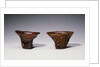 Two Chinese Rhinoceros Horn Libation Cups with Carved Designs by Anonymous
