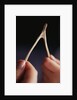 Two hands and a Wish Bone by Anonymous