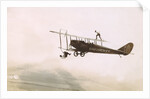 Photograph of a Wingwalkers on a Biplane by Anonymous