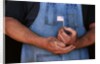 Man Holding Small American Flag by Anonymous