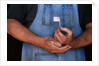 Man Holding Small American Flag by Anonymous