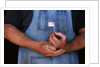 Man Holding Small American Flag by Anonymous